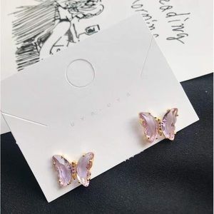 Purple glass butterfly stud earring